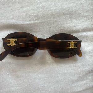 CELINE EYEWEAR Triomphe oval-frame tortoiseshell acetate sunglasses
